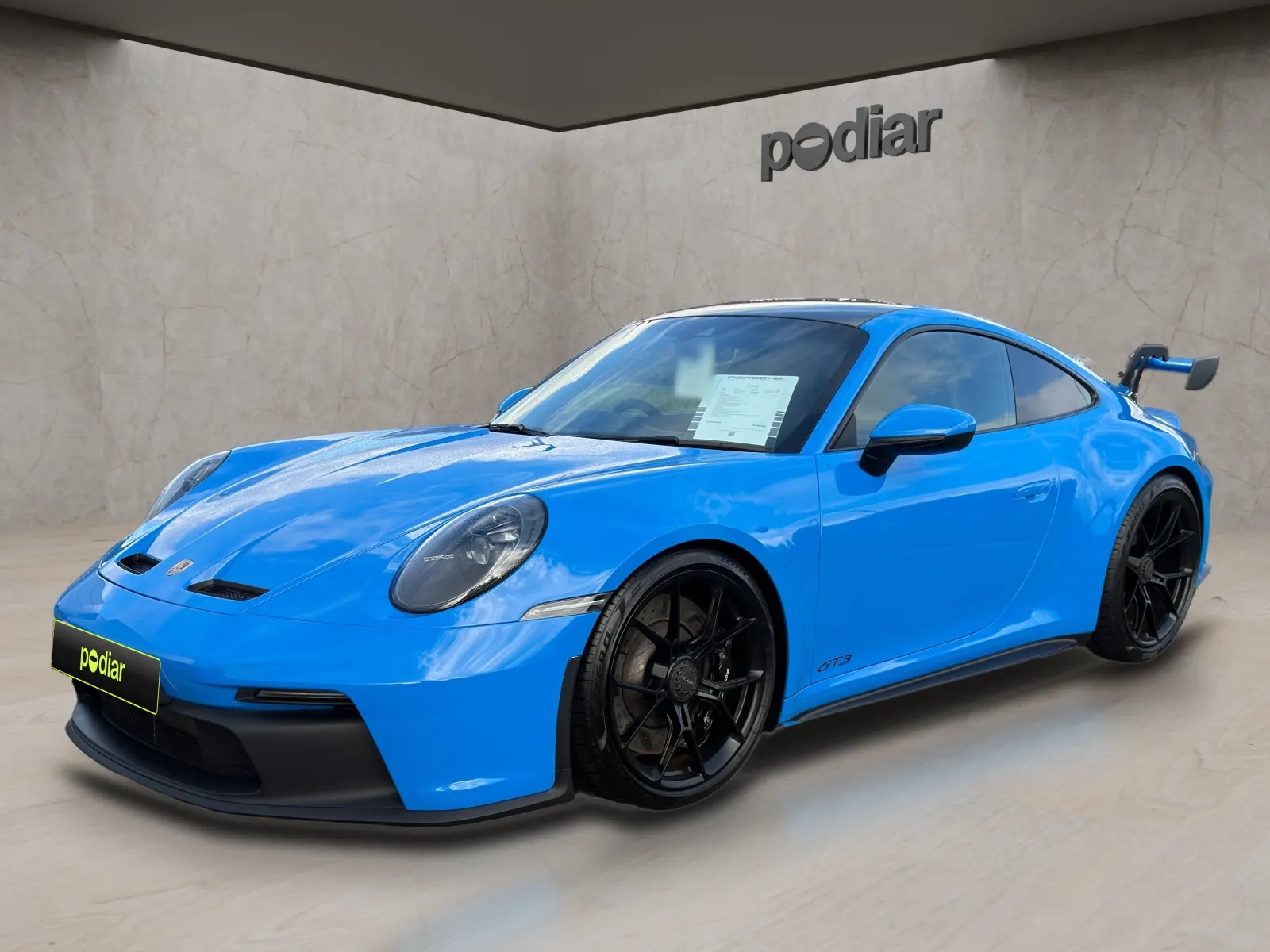 Porsche 911 GT3 published to a dealer site, in the Stone Honeycomb showroom