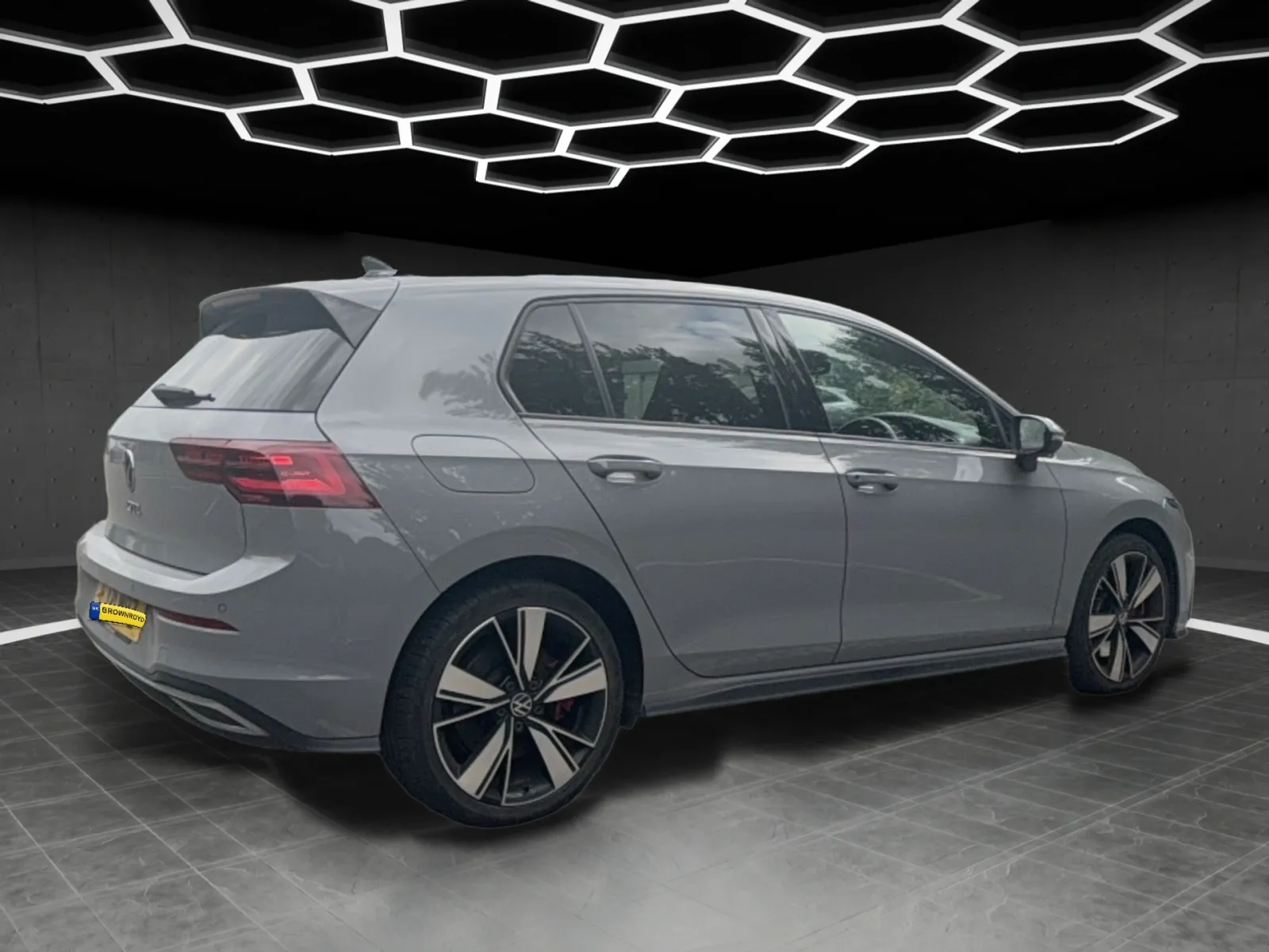 Volkswagen Golf GTE in the Midnight showroom, rear three-quarter, left